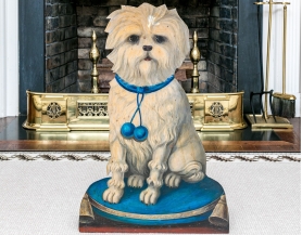 A semi-antique Tole dog-form umbrella stand featuring a cream colored dog with blue collar sitting on a blue pouf pillow with tassels | BRG