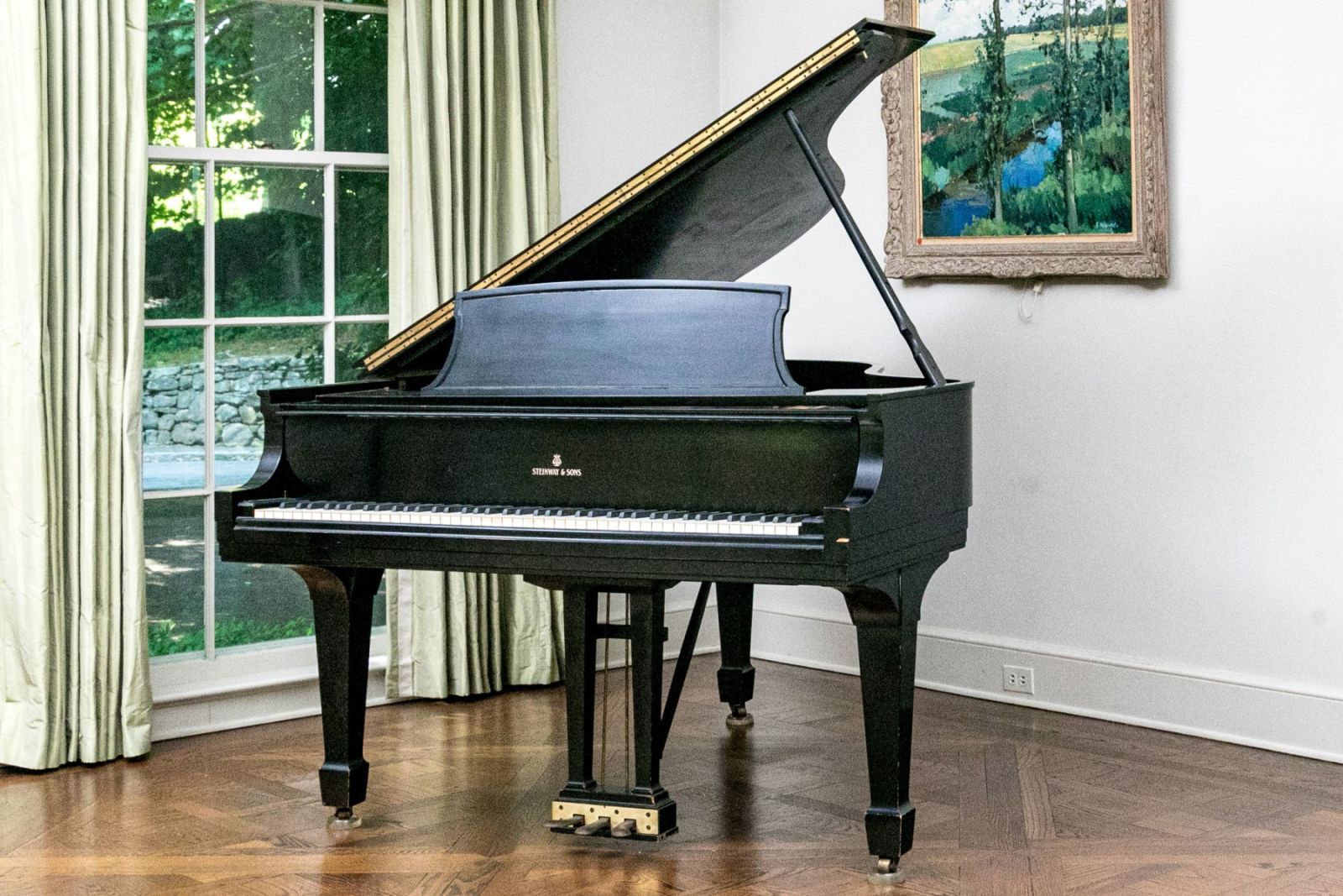 An ebonized Steinway and Sons model L grand piano