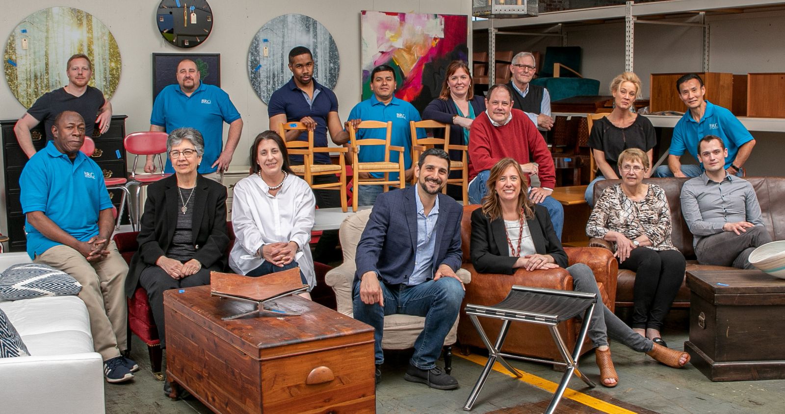 The BRG team poses for a photo inside the Bridgeport showroom with Managing Partners, Grant and Christie seated in the center.